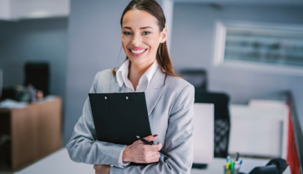 Saleswoman smiling while preparing a product demo on a tablet